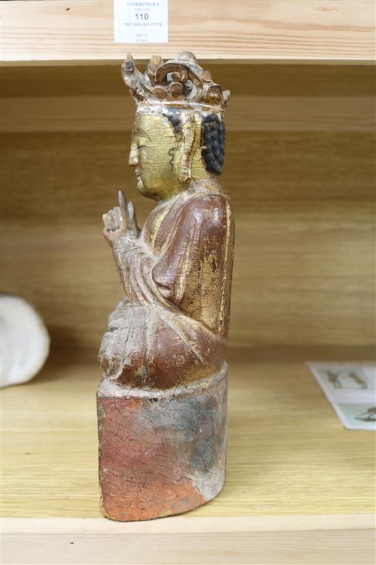 A Chinese gilt and polychrome wood seated figure of Buddha height 32cm